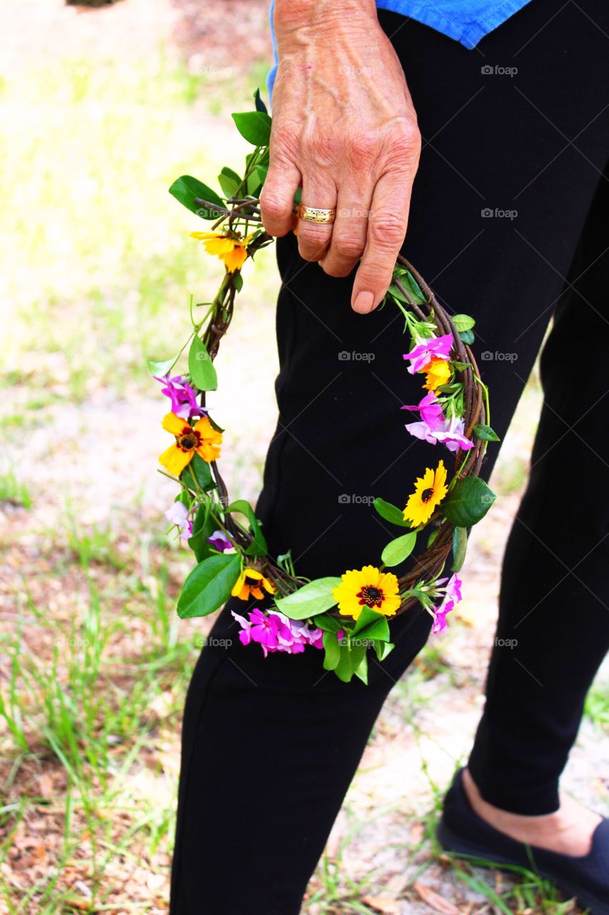 Holding a flower crown