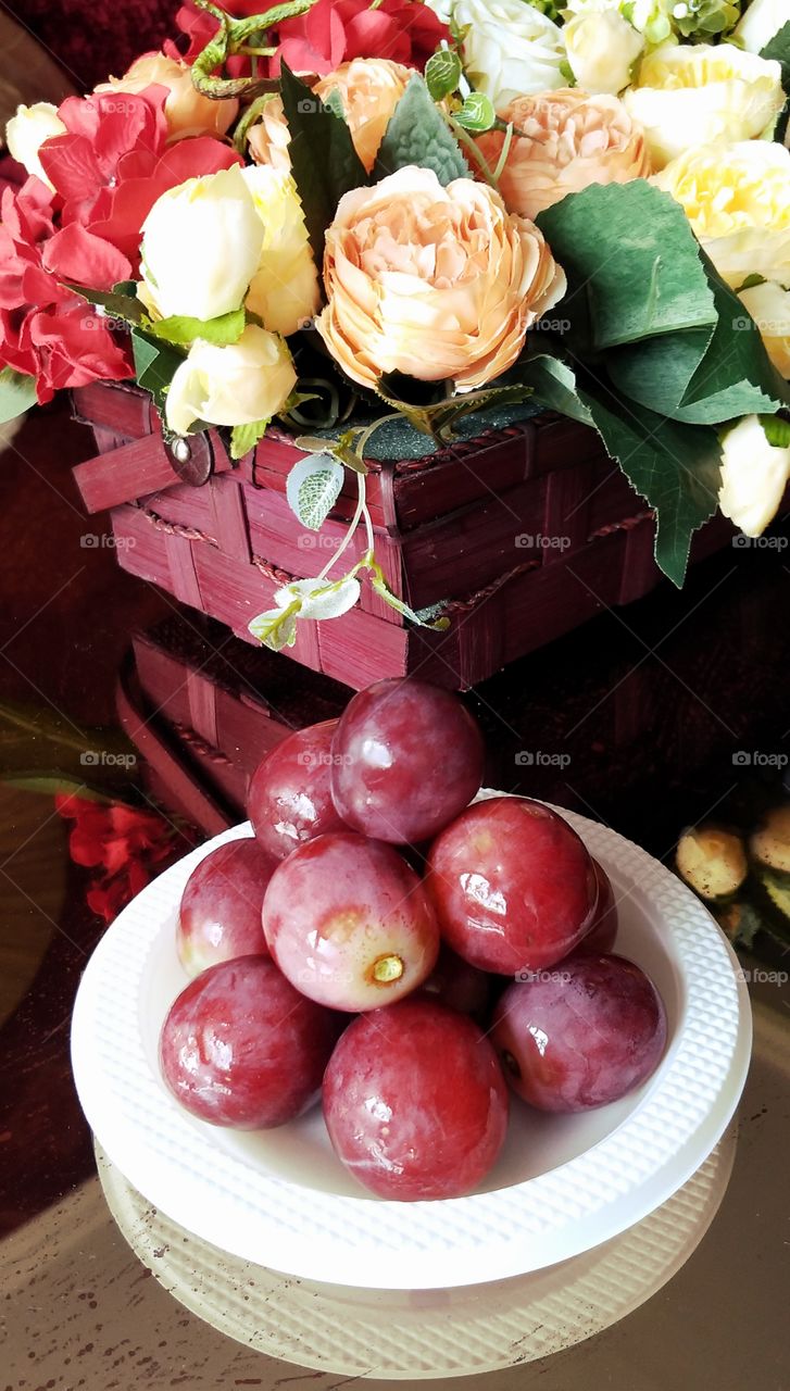 Grapes and flowers