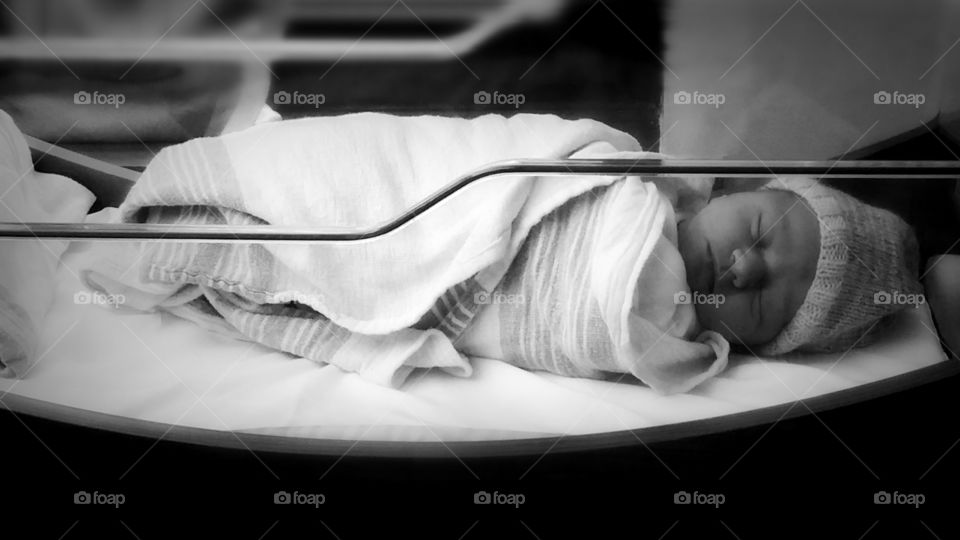 newborn in bassinet