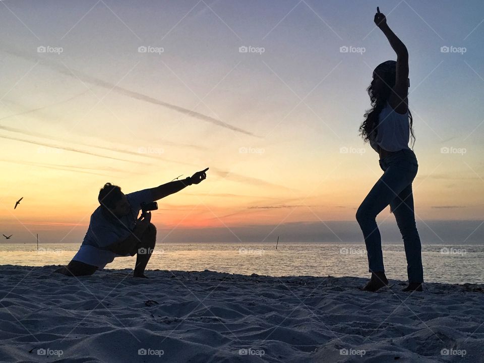Model posing for the photographer at sunrise 