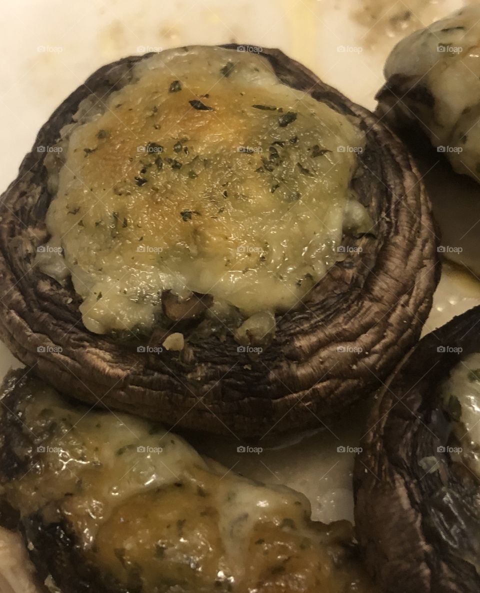 Artichoke and cheese stuffed portobello mushrooms 