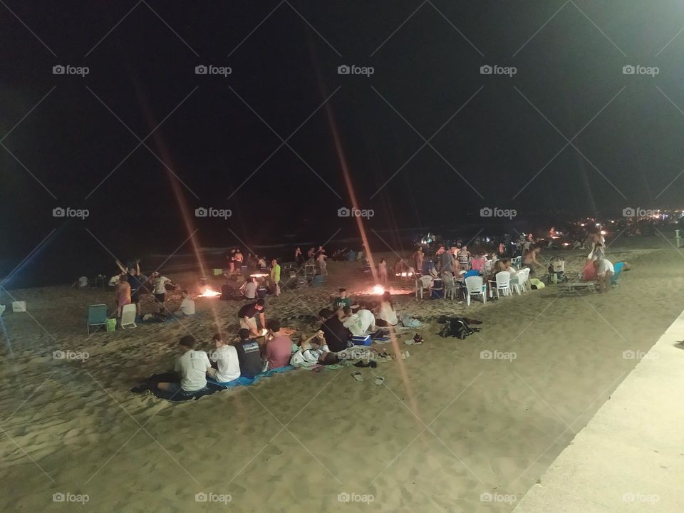 Crowds in nights beach