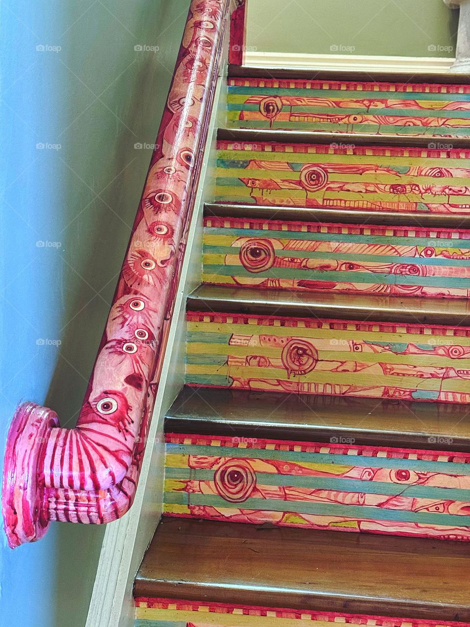 Eyeballs on a banister with painted steps 