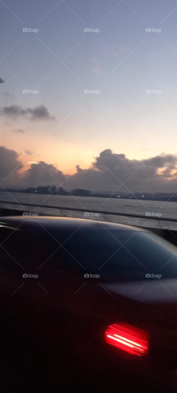 Beautiful view of the evening sky from the bride over the Ocean . Rare view of the evening sky