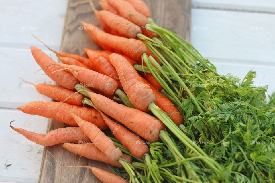 Overhead view of carrots on wood