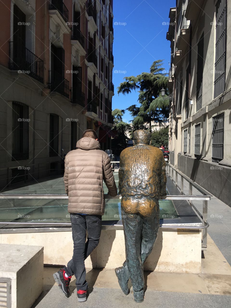 Statue and man in Madrid