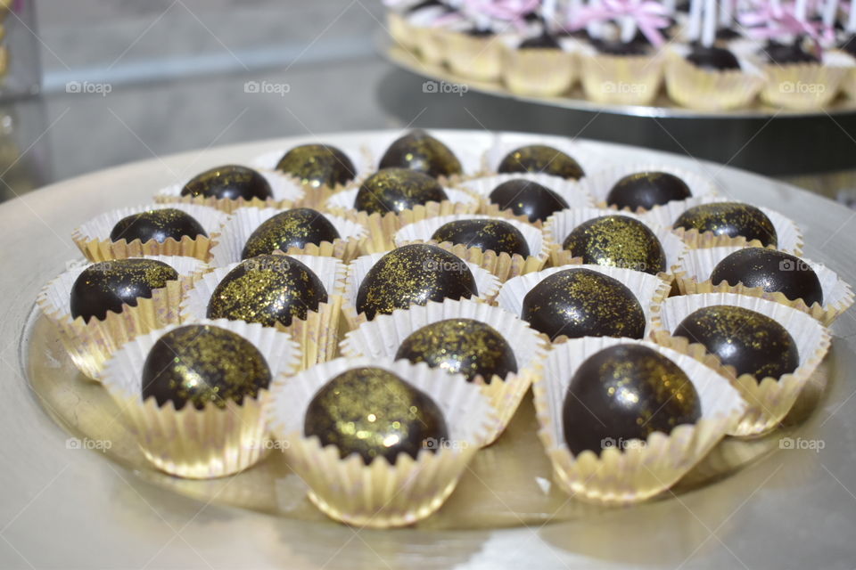 Chocolate ball with golden sparkles