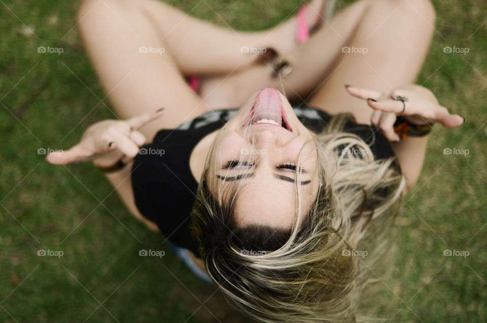 Woman showing hand sign