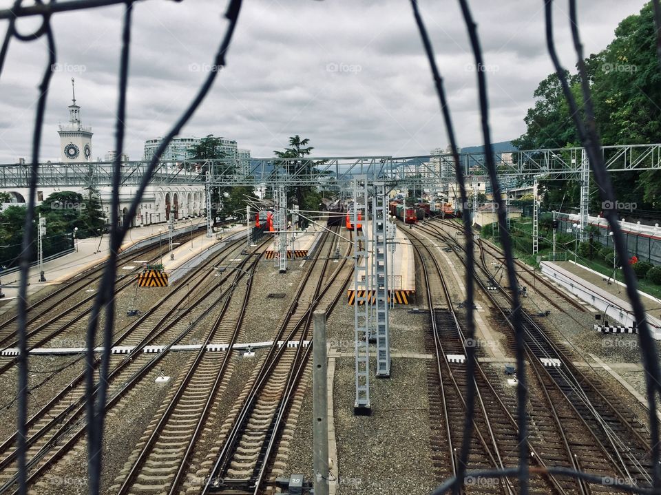Railway station view over metal lattice