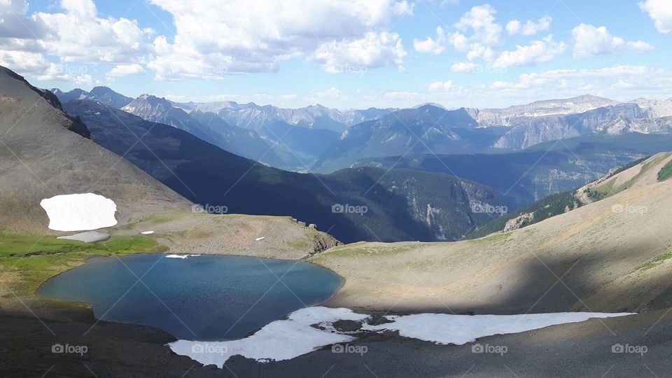Hidden lake high in the Canadian Rockies near Northover Ridge in Kananaskis, Alberta, Canada