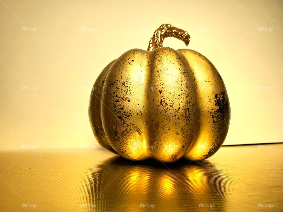 Gold pumpkin and its reflection