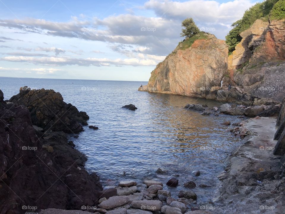 Babbacombe Cliffs in Torbay in early evening sunshine.