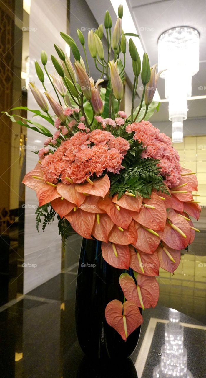 pink carnation lily and flamingo flower in vase 