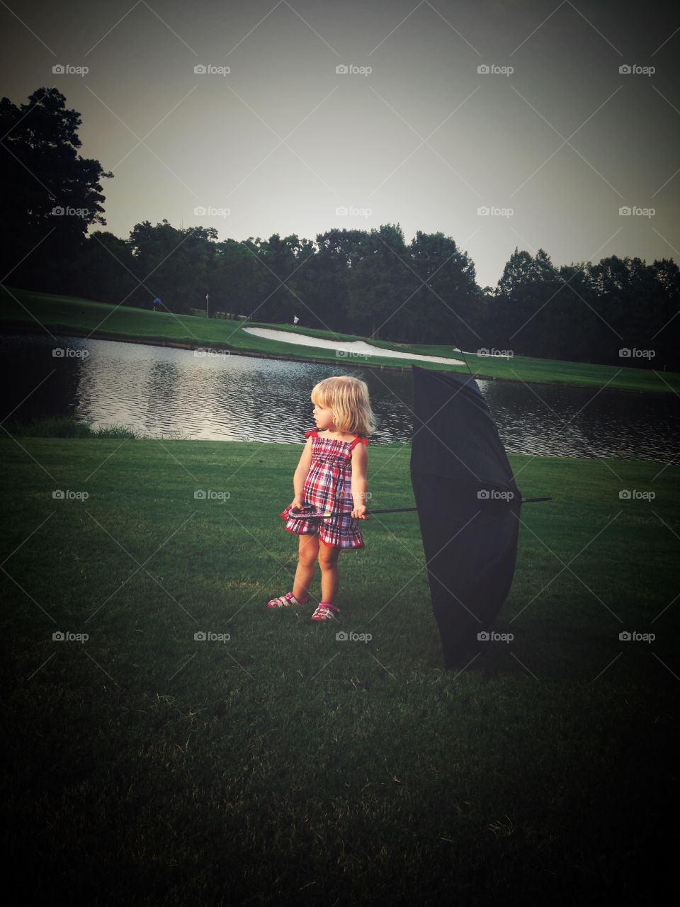 Umbrella girl . Waiting for fireworks in the rain 