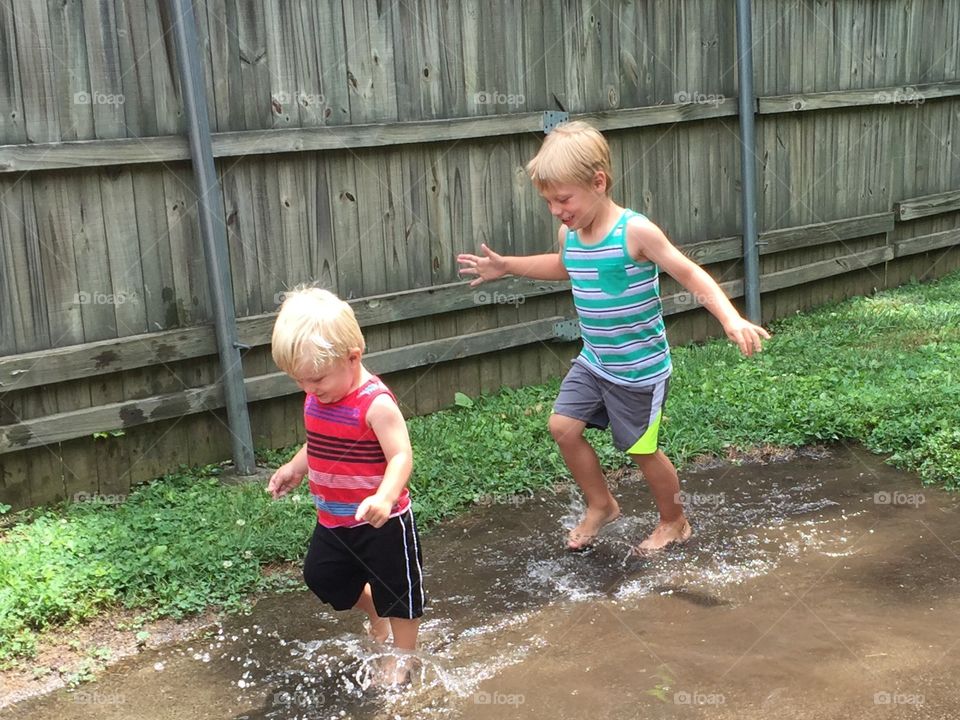 Playing in rain puddles 
