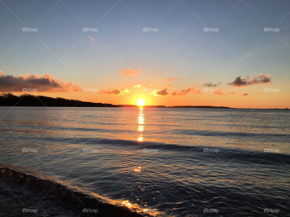 Scenic view of sea at sunrise