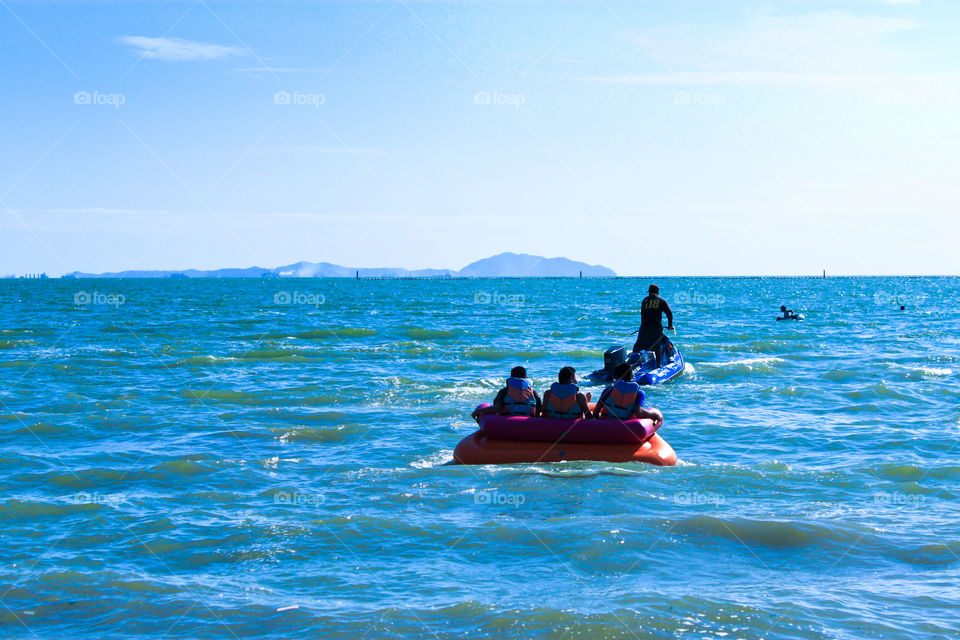 People travel at the sea to relax, swim in the summer.