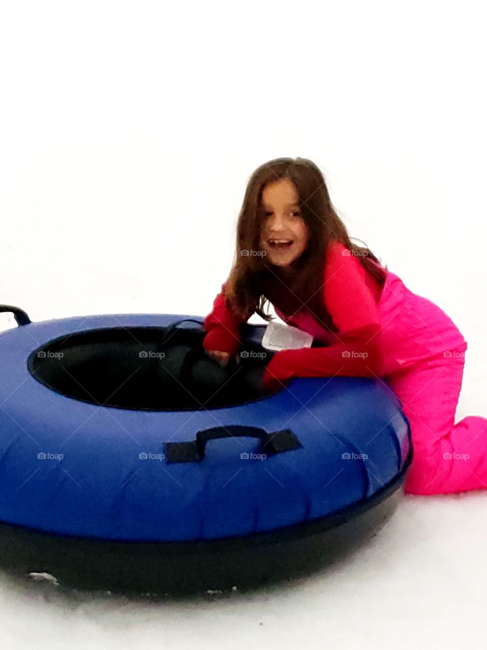 girl playing in the snow