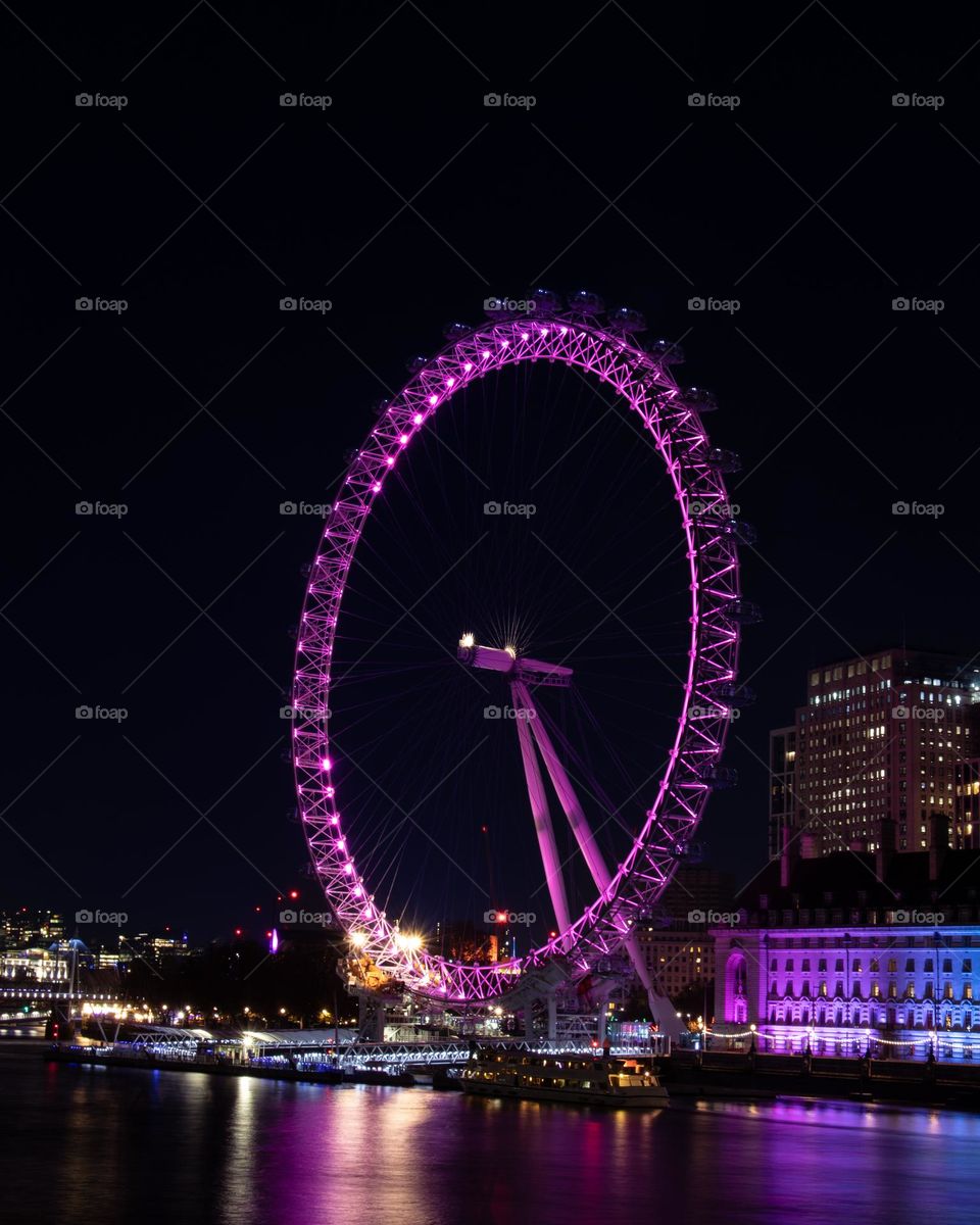 Night wheel at the riverside long exposure