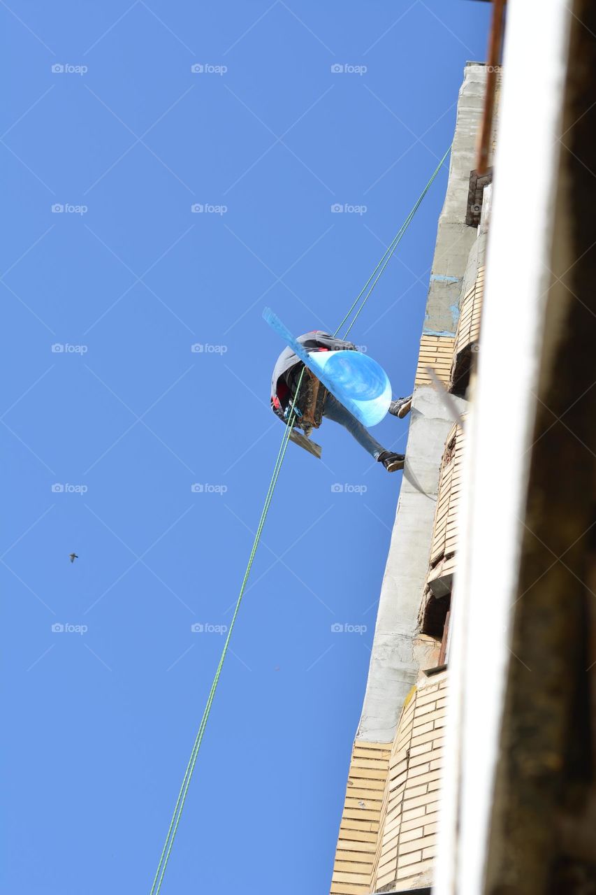 builder working blue sky background