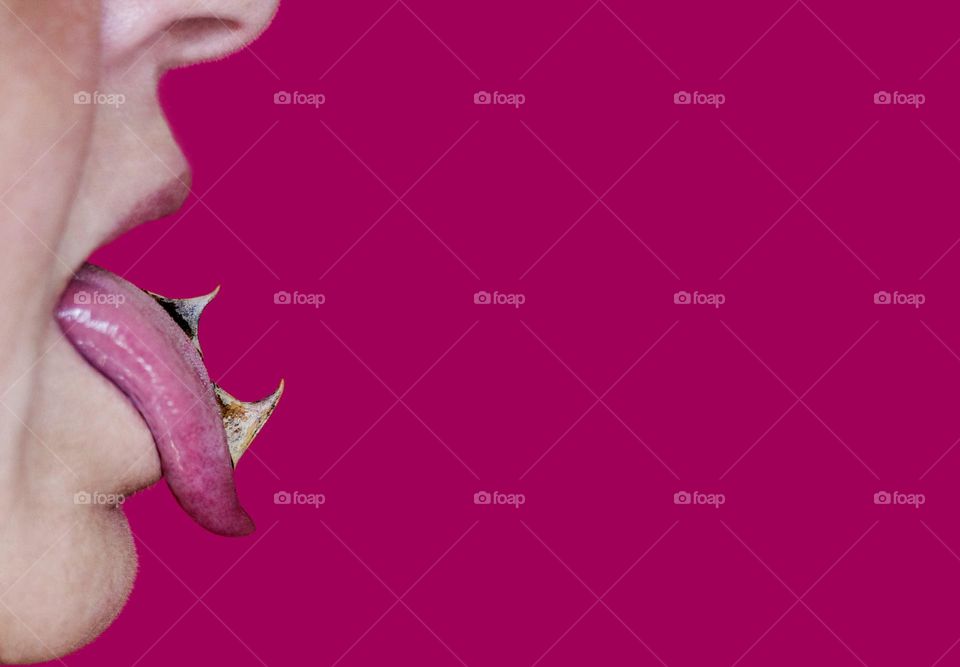 Spiky tongue on magenta background