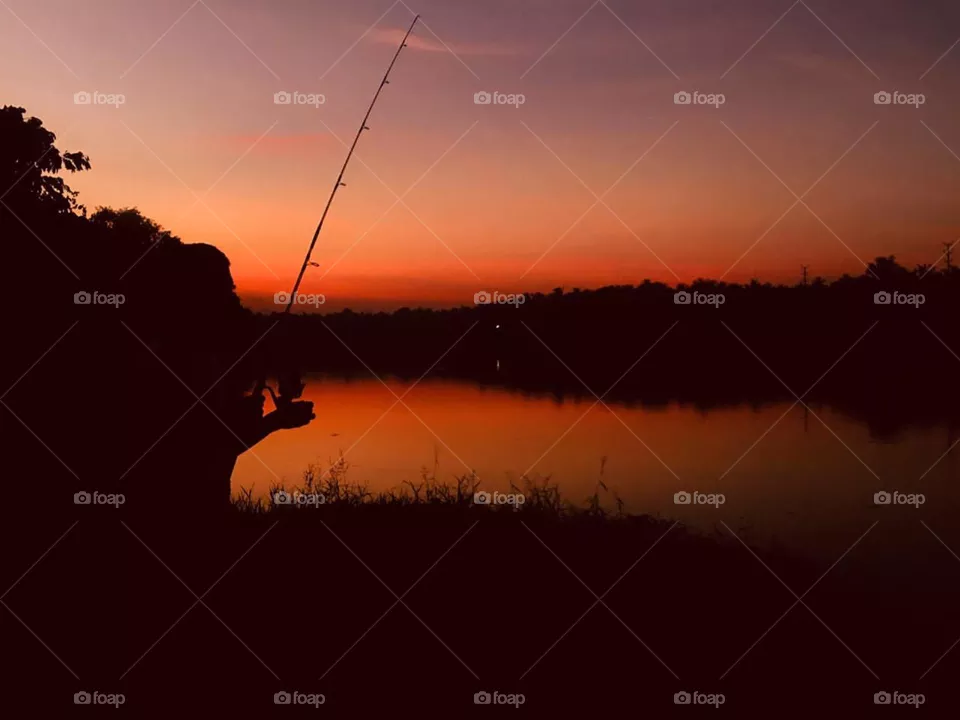 Fishing at sunset