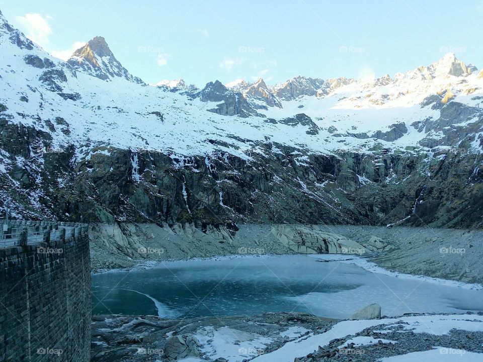 An iced alpine lake in the Gran Paradiso National Park.
