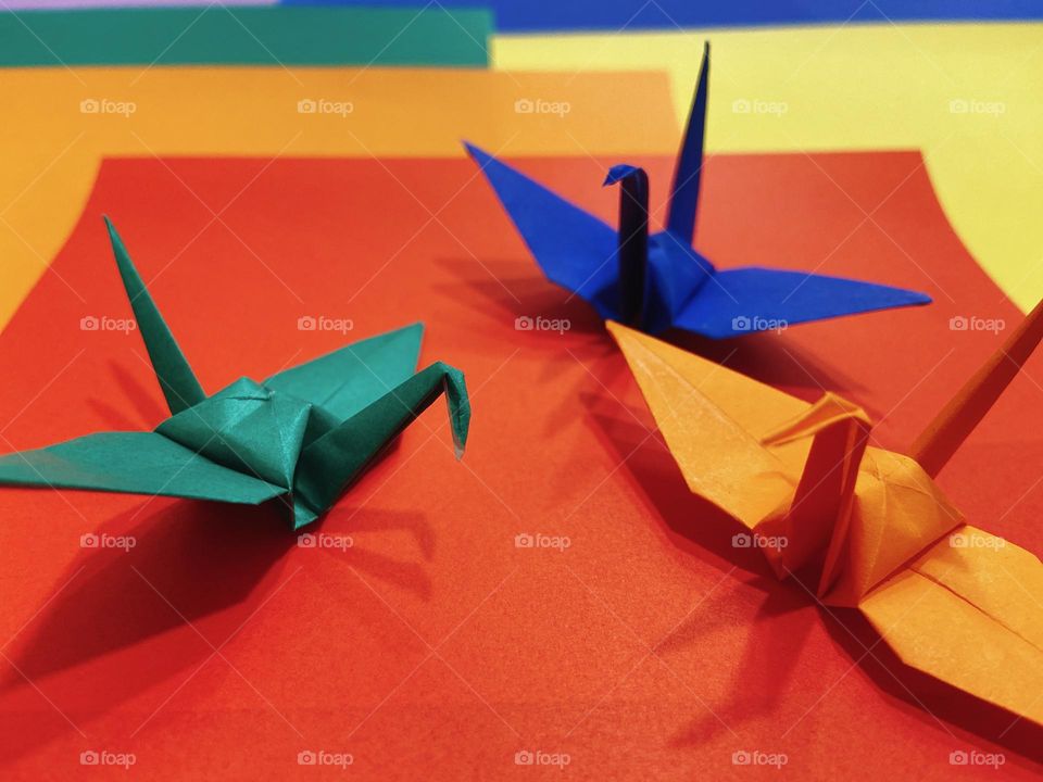 A Spectrum of Colors: Paper Cranes on Vibrant Colored Paper 