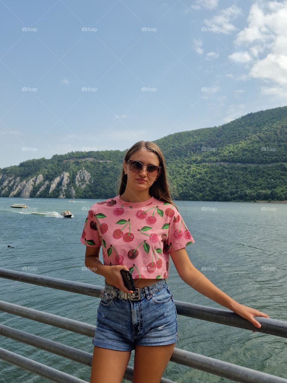 the young girl with the magenta t-shirt with cherries