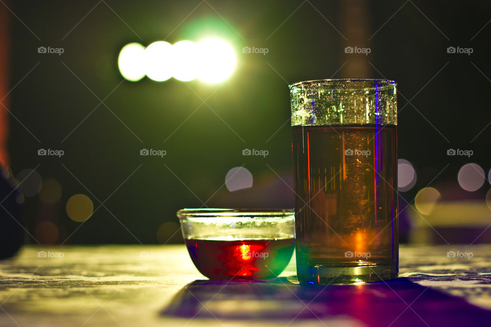 Coke in glass and rose petal in water, coke, beverages