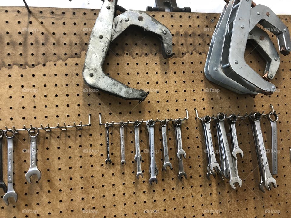 Old tools hanging on at pegboard