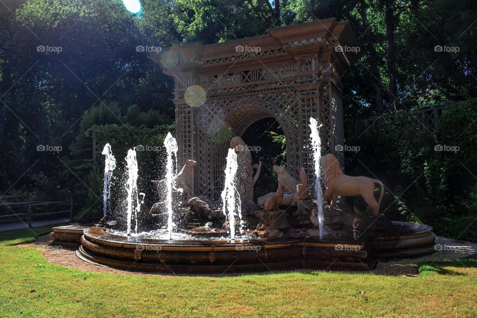 Fountain with sculptures and lens flares