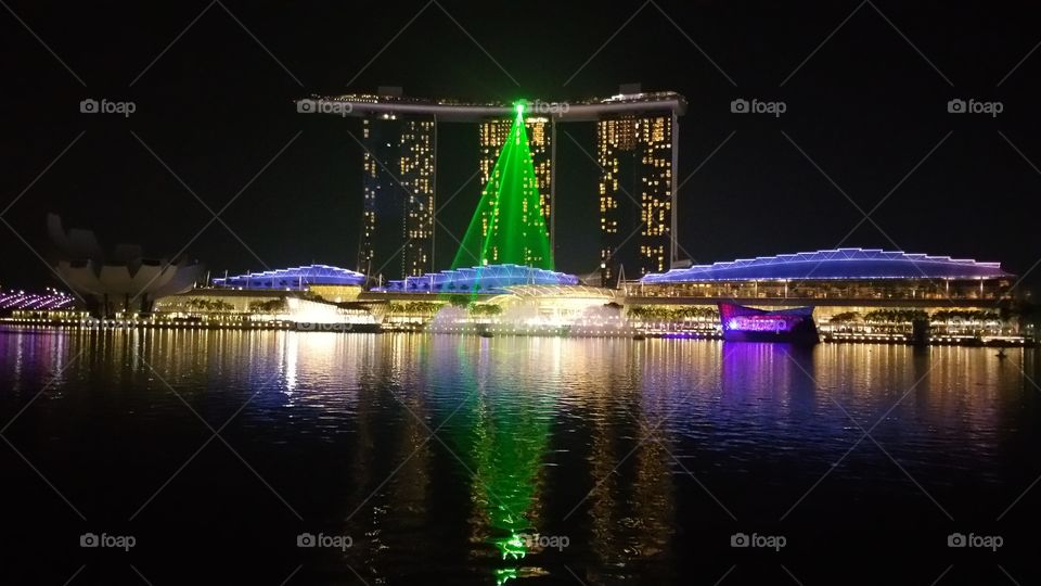 Six high powered Stella-Ray and Light-Ray Laser display at the waterfront event Plaza, Skypark, Marina Bay Sands  and ArtScience Museum Oculus. Singapore.