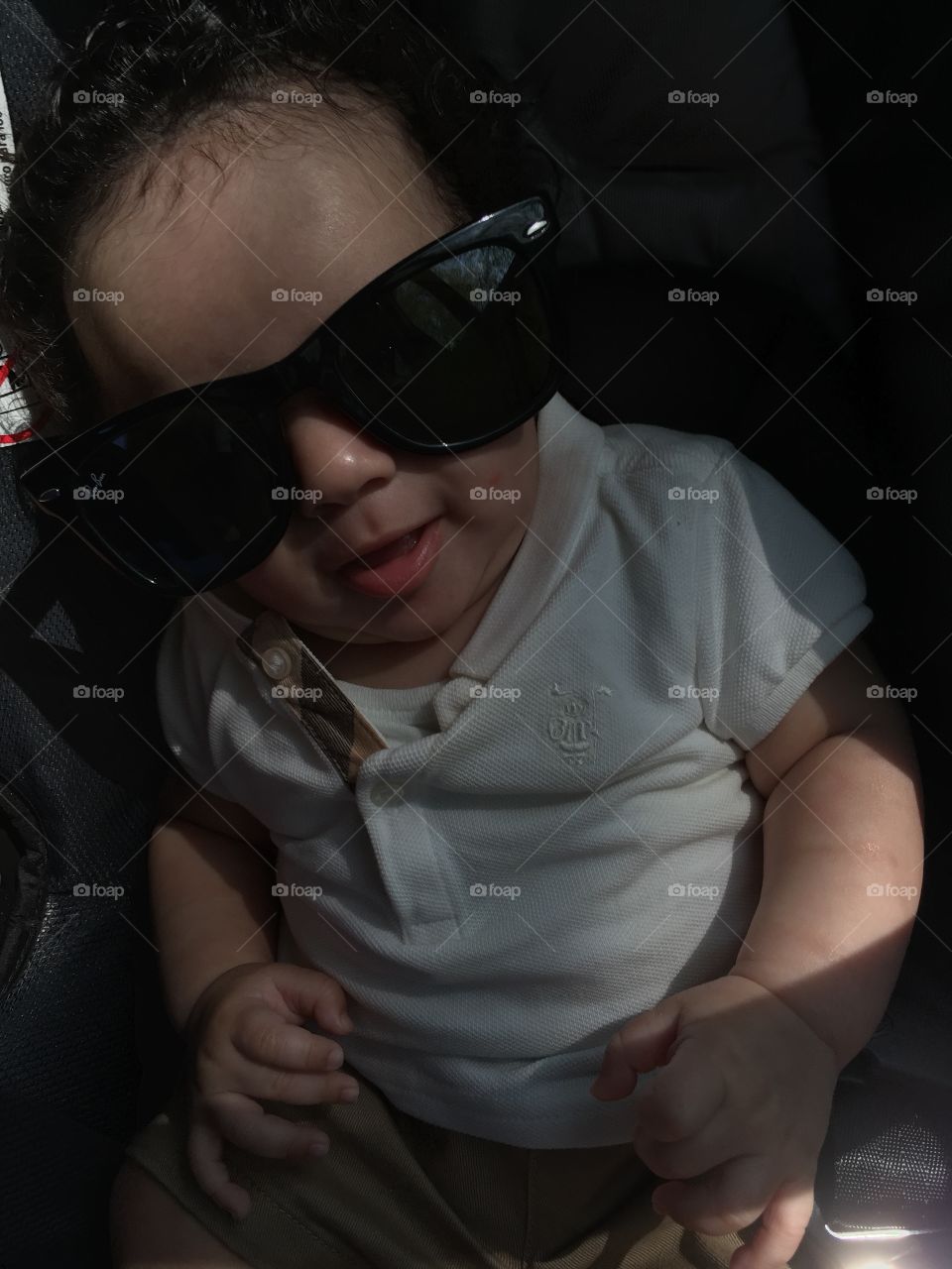 Cayden . A ride in the car with my shades on 