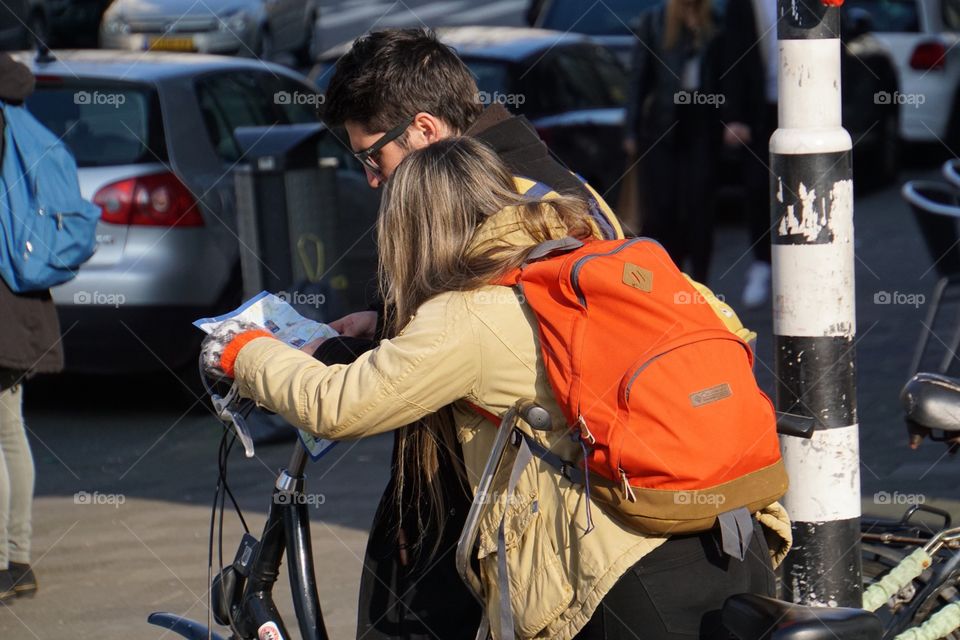 Lost tourists looking at a map