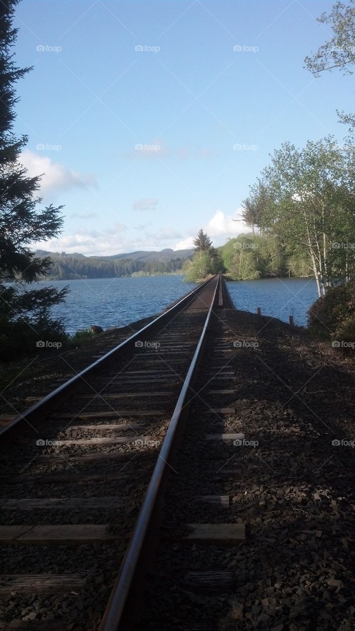 Railroad track along Siuslaw Lake near Florence, Or