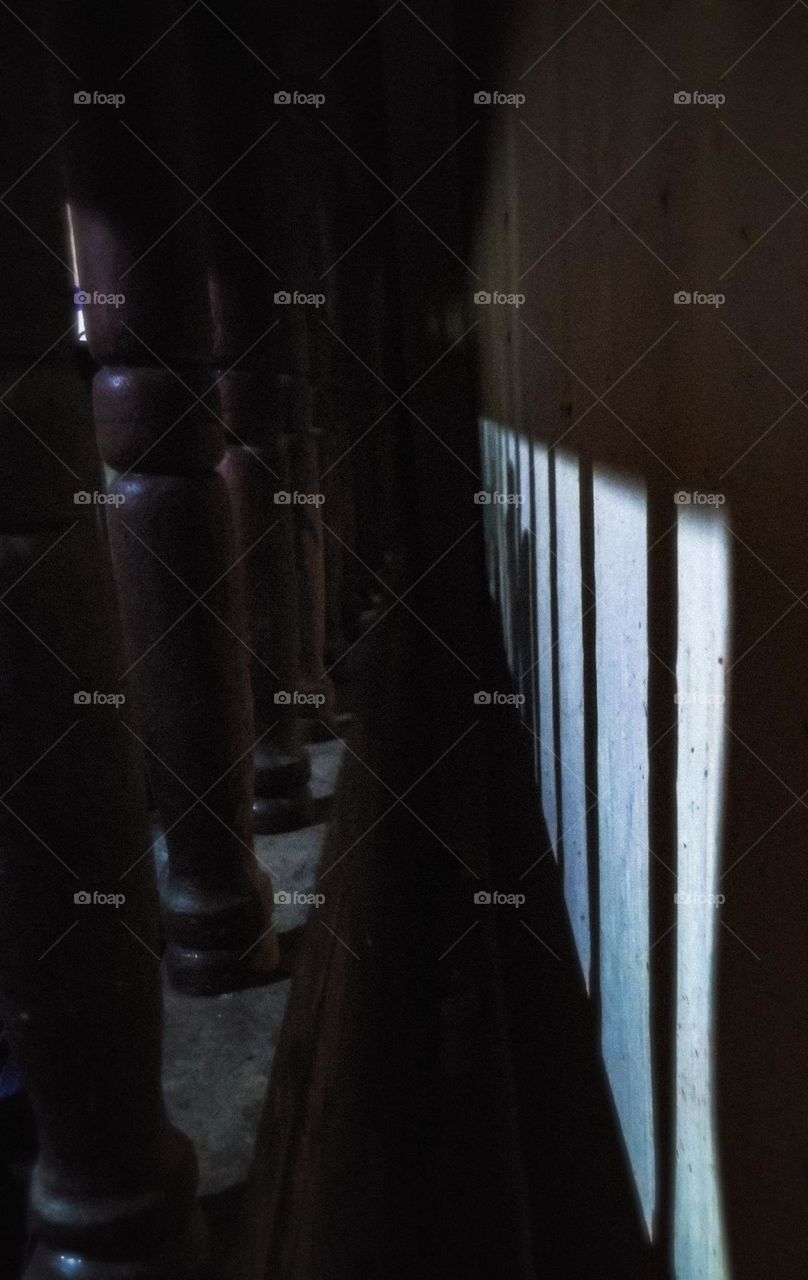 This is a traditional architecture view and these are made by woods. This is a very creative idea with wooden sticks with their shadows. This is a reflection of a darkness and shadows .