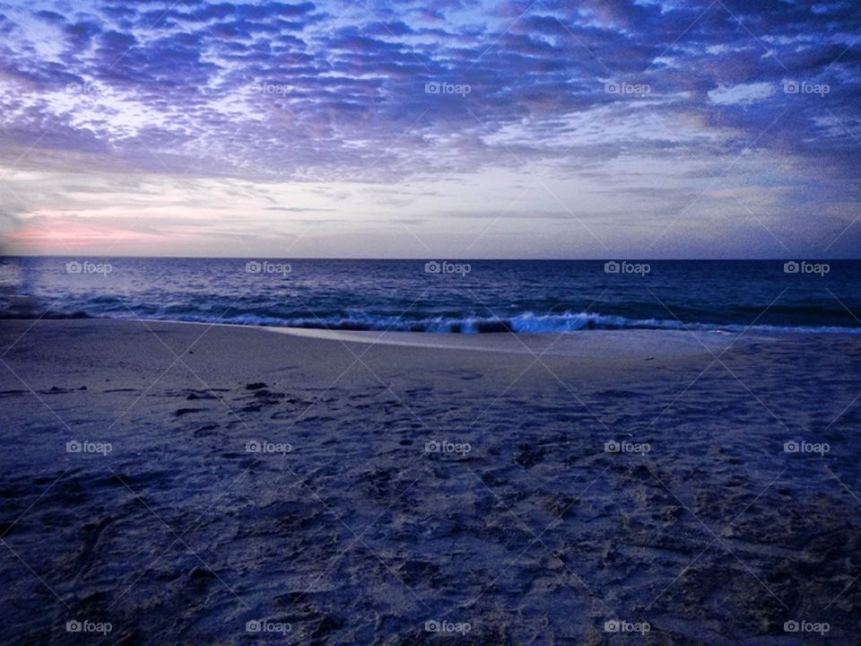 beach ocean sunset clouds by EthaNox
