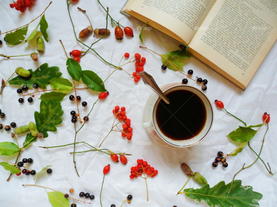 black coffee cup and book