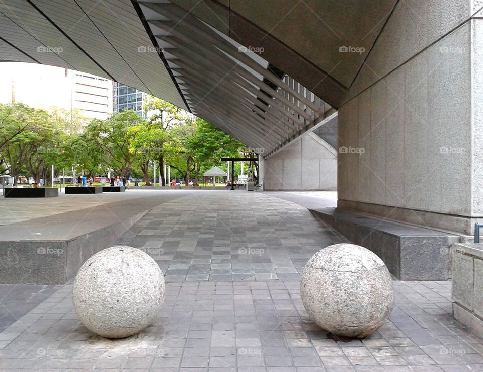 arched structure and concrete spheres