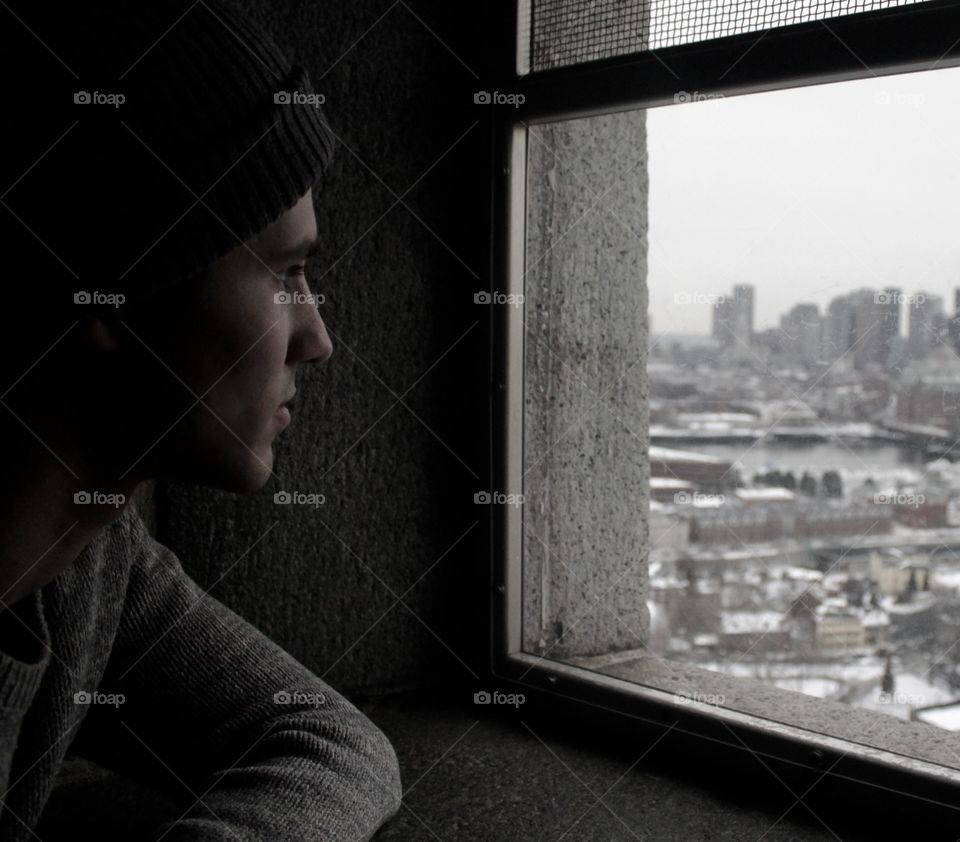 Man looking through the window