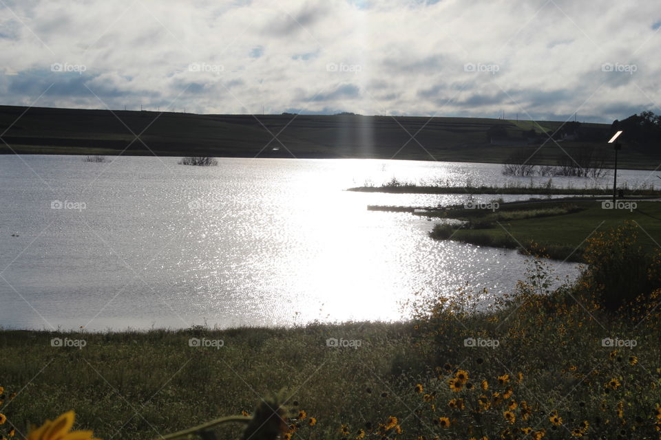Beautiful Wide and New Lake with Sun shining on it causing water to shimmer and sparkle