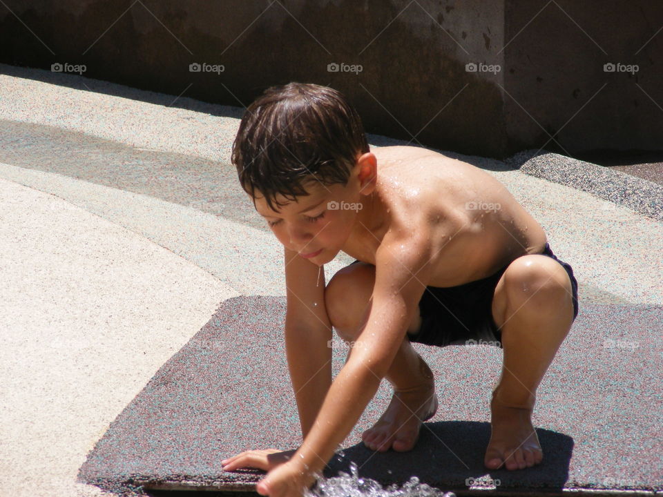Close-up of a wet shirtless man