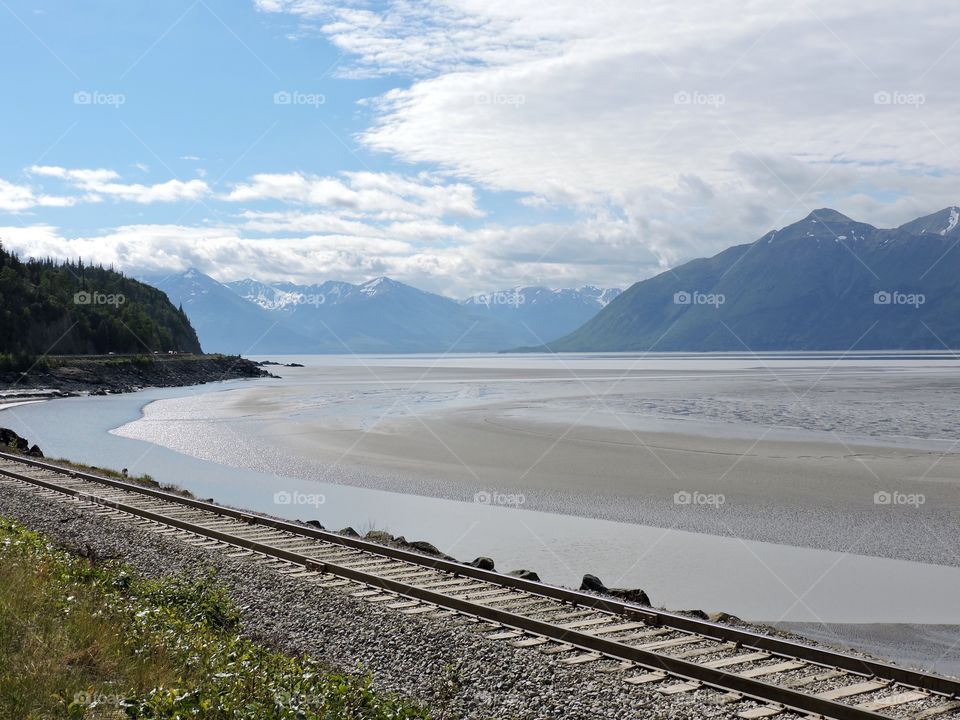 Alaskan Railway Along The Coast With Tide Out