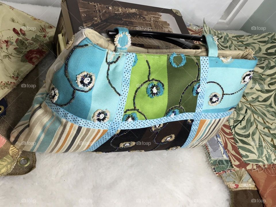  Patchwork Purse is a unique, one of a kind bag, in a gorgeous assortment of prints and solid fabric samples and remnants that create a neutral yet versatile 