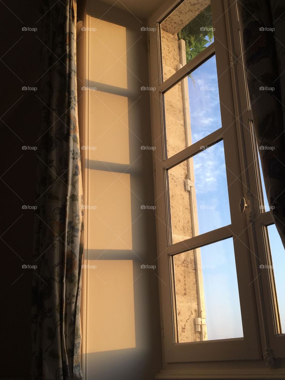 Sunrise on glass window from inside 
