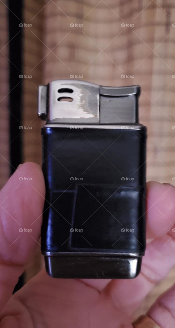 A rectangle is a shape in geometry. Geometry is one of the many forms of math and a Rectangle is included in that. Here's a perfect example - a black leather butane gas lighter.