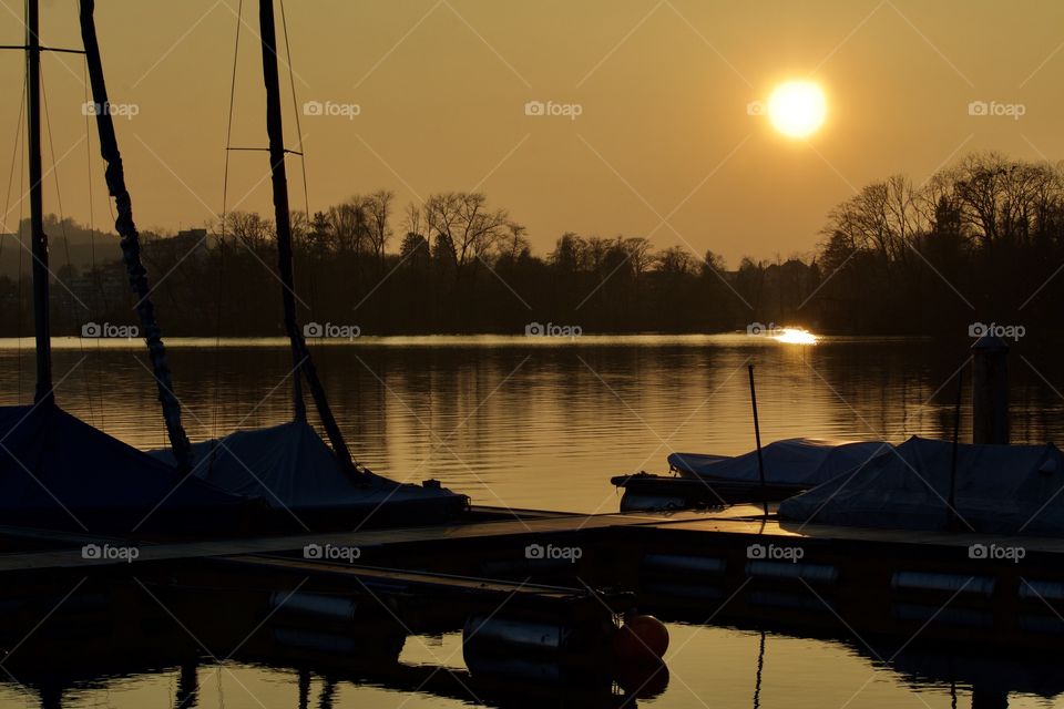 Reflection of sunset and watercrafts