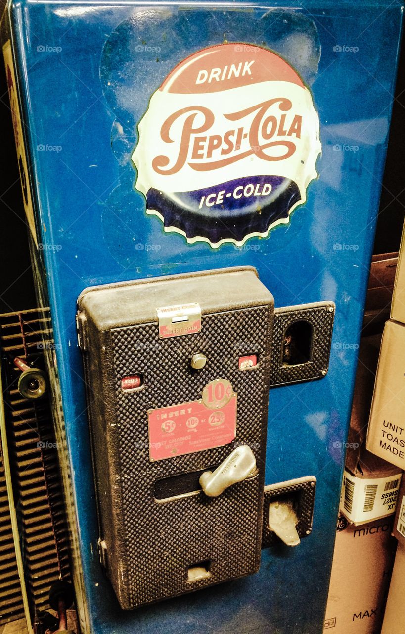 Old Pepsi Machine. Put a dime in, turn the crank and you wait for your bottle of Pepsi to drop down for you to enjoy. 