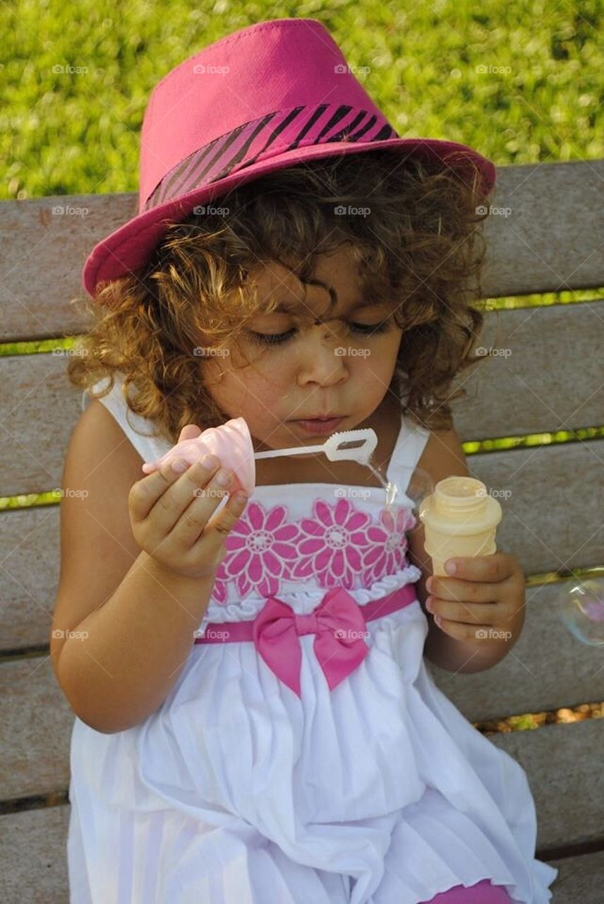 Bubbles. Sitting in the park blowing bubbles